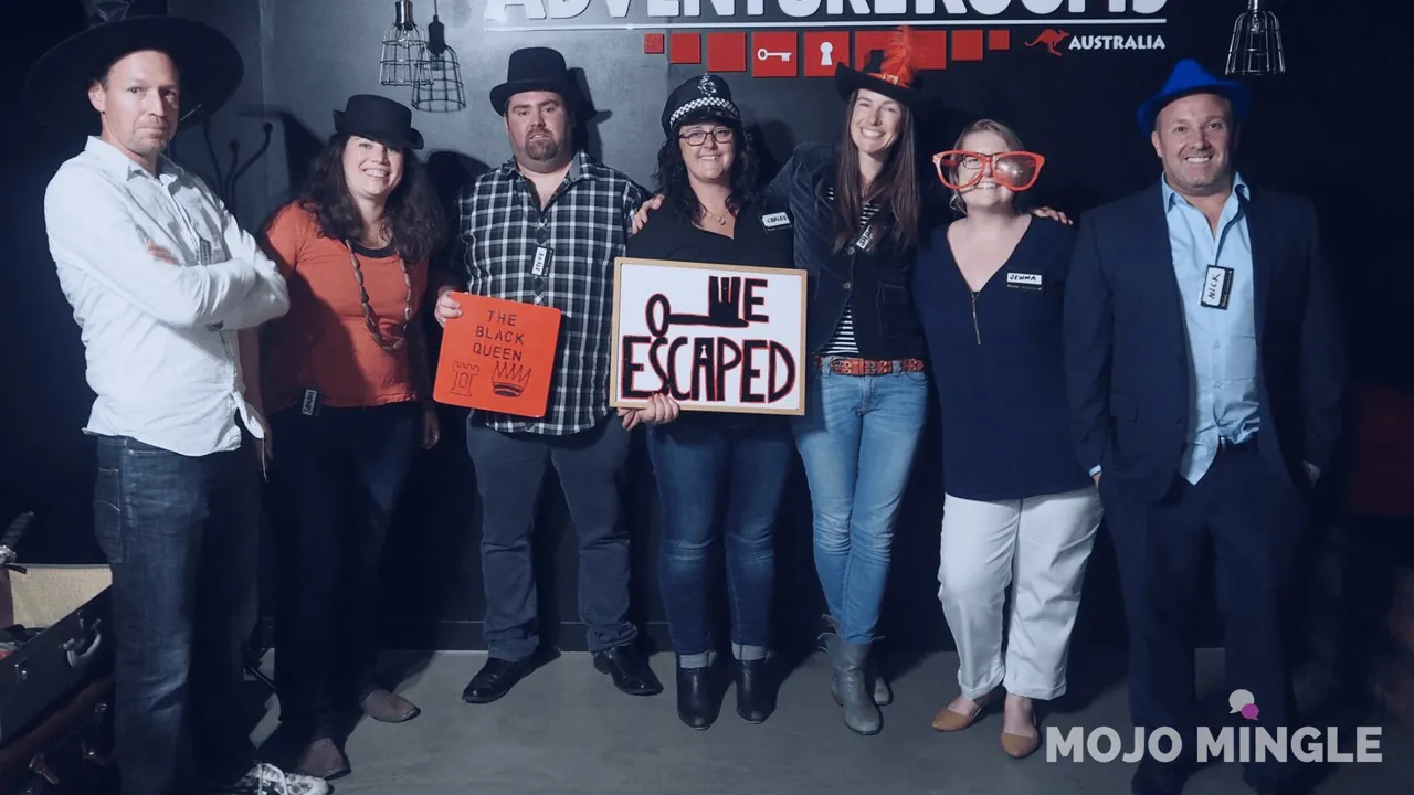 Singles escape-room team celebrating