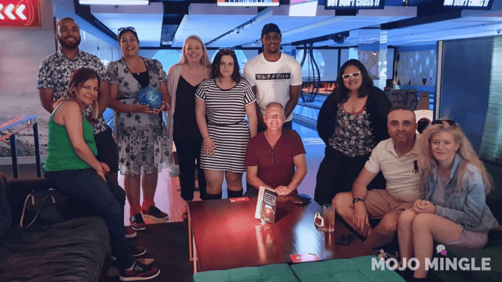 group of happy singles at bowling lanes in Sydney, Australia